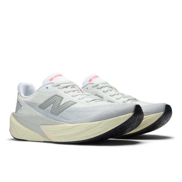 White running shoes with black soles on a white background