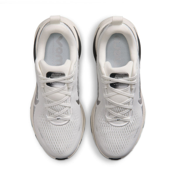 White athletic shoes with black accents on a white background