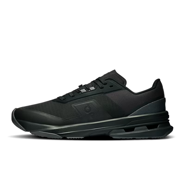 A black athletic sneaker with a chunky, layered sole and textured mesh upper, shown in a side profile on a white background.