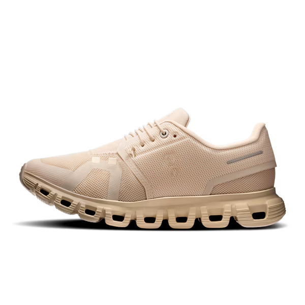 Beige running shoe with a transparent sole on a black background