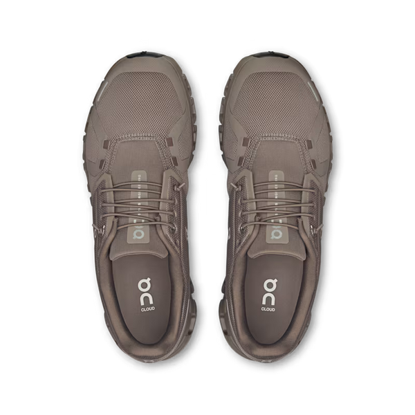 A top down look a a pair of On Cloud 6 lifestyle shoes with the on logo on the sockiner and tongue.