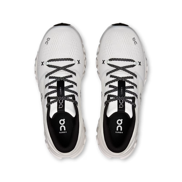 A pair of white and black On Cloudrunner trail running shoes shown from a top-down view on a solid white background.
