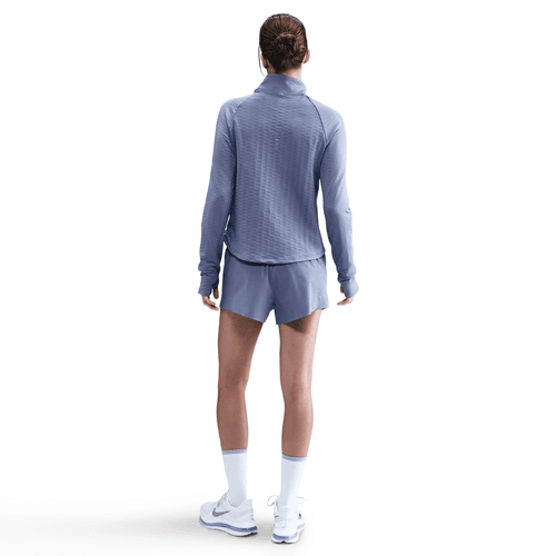 Person wearing a blue athletic outfit on a white background