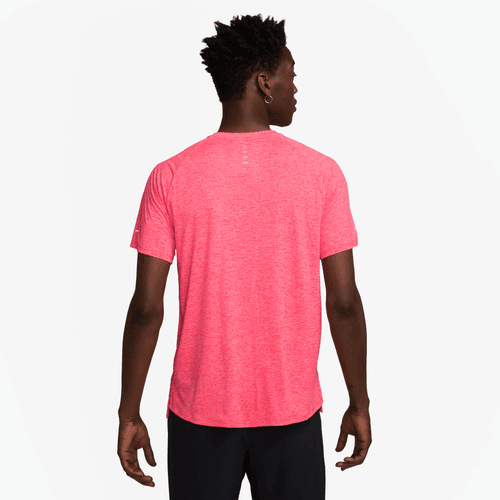 Person from the back wearing a bright red t-shirt on a white background