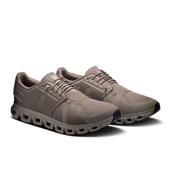 A pair of tonal Men's On shoes with a black outsole.