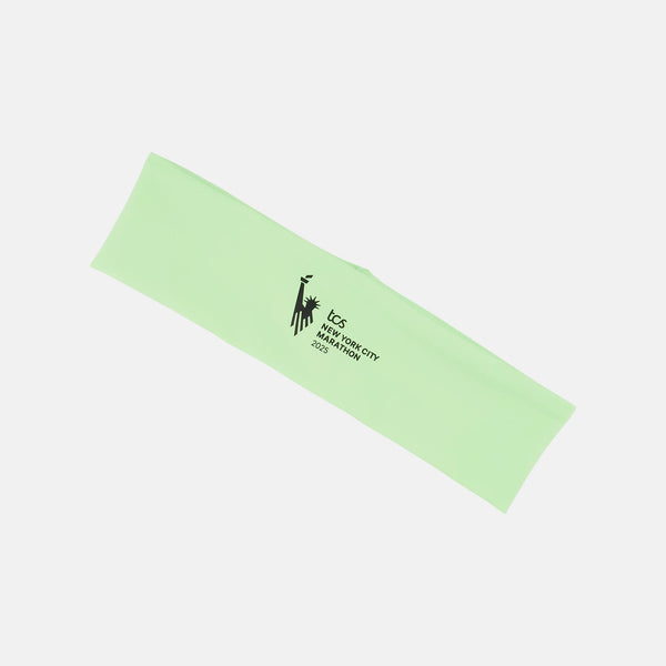 Light green headband with black text and logo on a white background