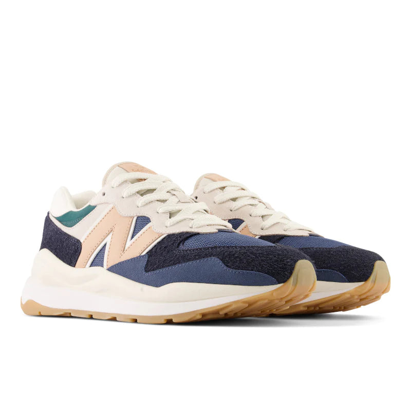 Front angle view of the Men's New Balance 5740 Lifestyle shoe in the color Blue/Black/Peach