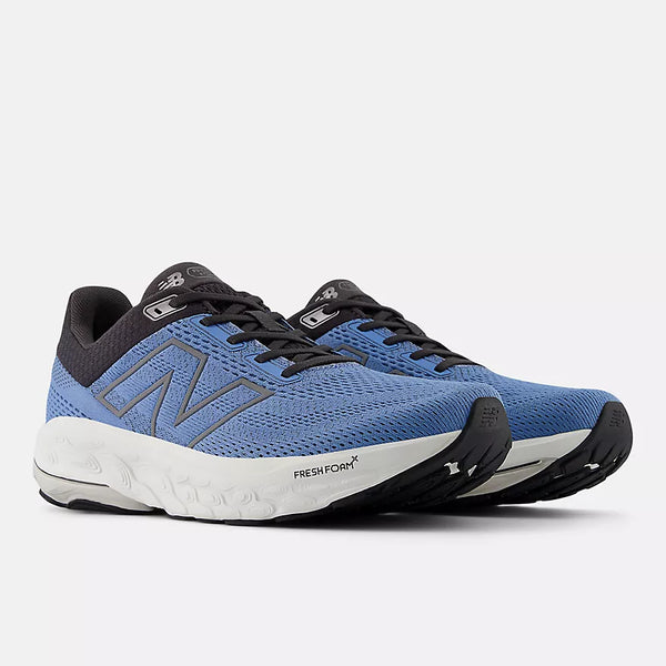 Blue running shoes with black and white accents on a light gray background
