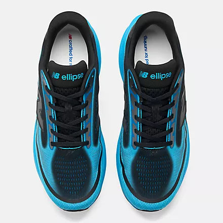 A New Balance running shoe in bright blue, black, and gray, shown against a light gray background.