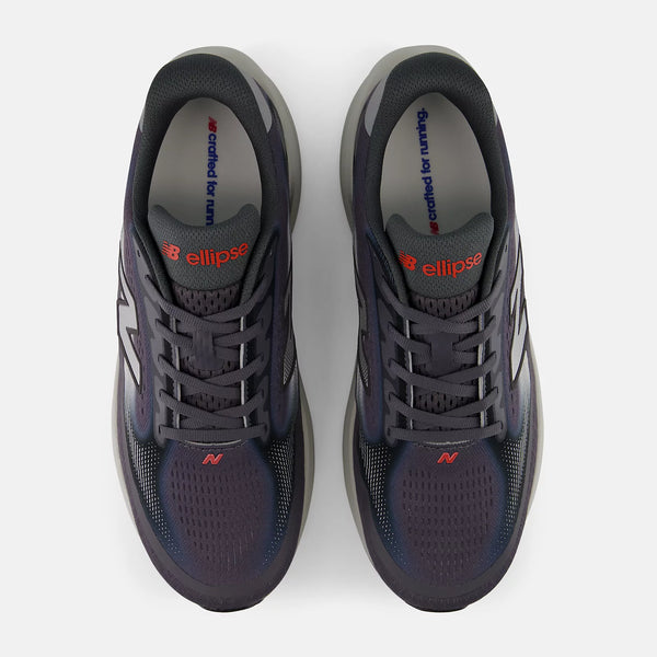 Pair of dark blue running shoes with visible brand logo on a white background