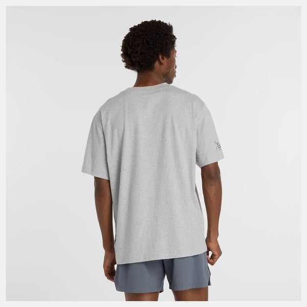 Person wearing a gray t-shirt and shorts on a white background