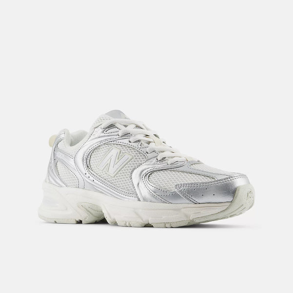 Silver New Balance sneaker on a white background