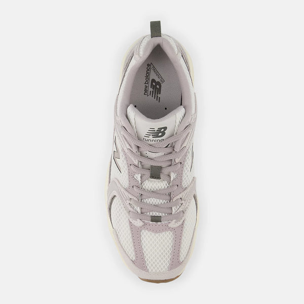 White sneaker with New Balance logo on a white background