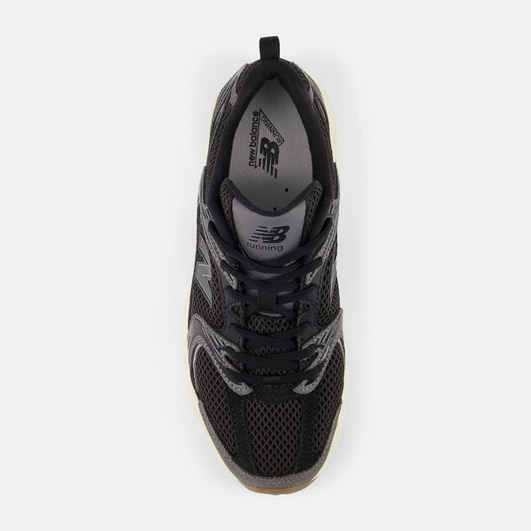 Black fasion shoe with New Balance logo on a white background