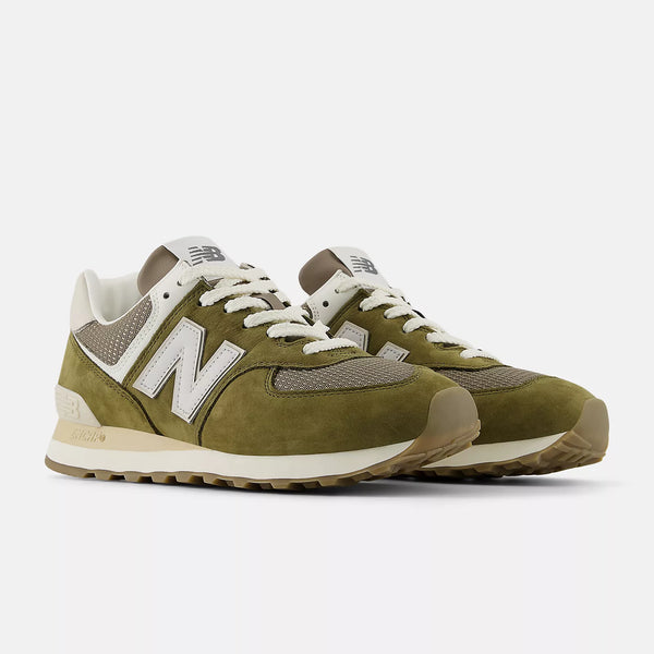 Pair of green New Balance sneakers on a white background