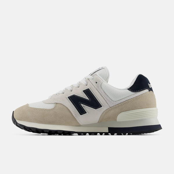 Beige and navy New Balance sneaker on a white background