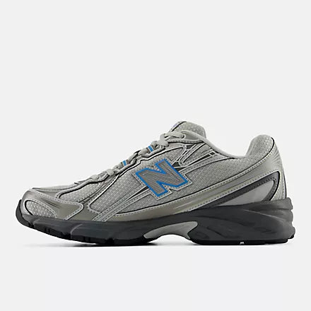 A New Balance athletic shoe in gray and black with a blue 'N' logo on the side, shown against a light gray background.