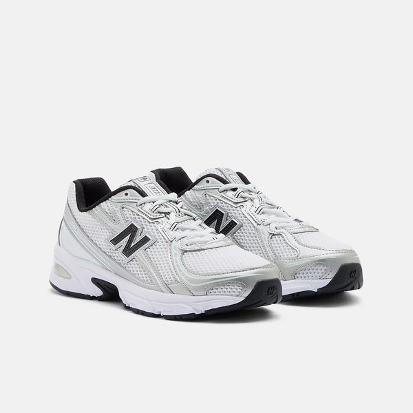 White running shoes with black accents on a white background
