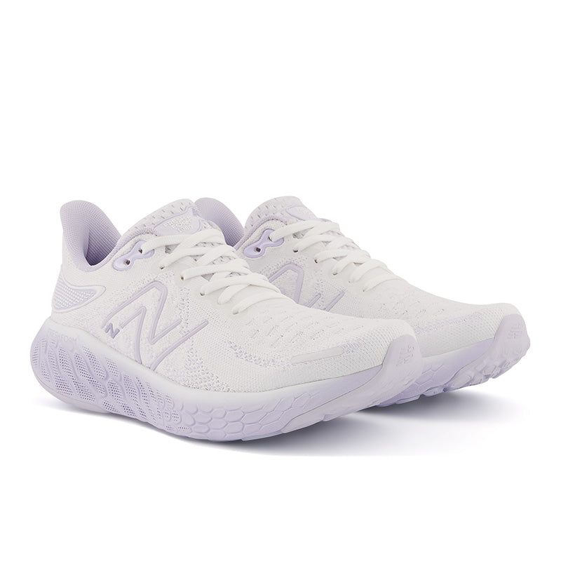 Front angled view of the Women's 1080 V12 in the color White libra/Violet Haze
