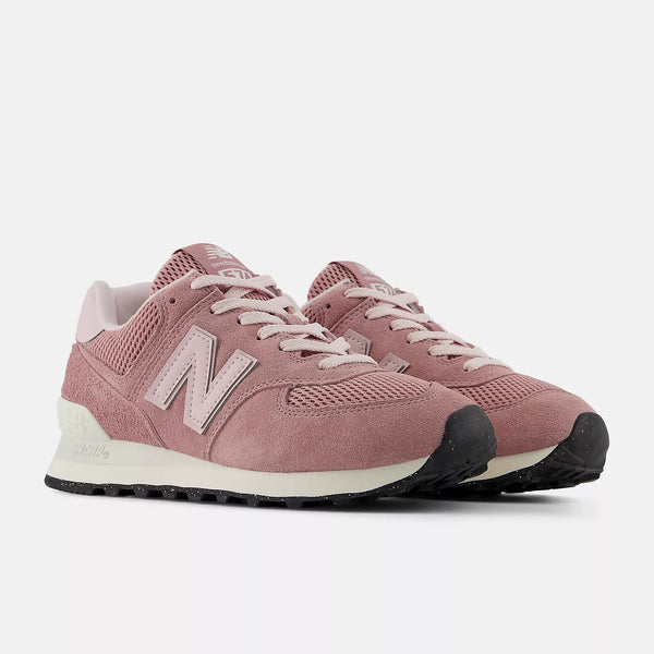 Pair of pink New Balance sneakers on a white background