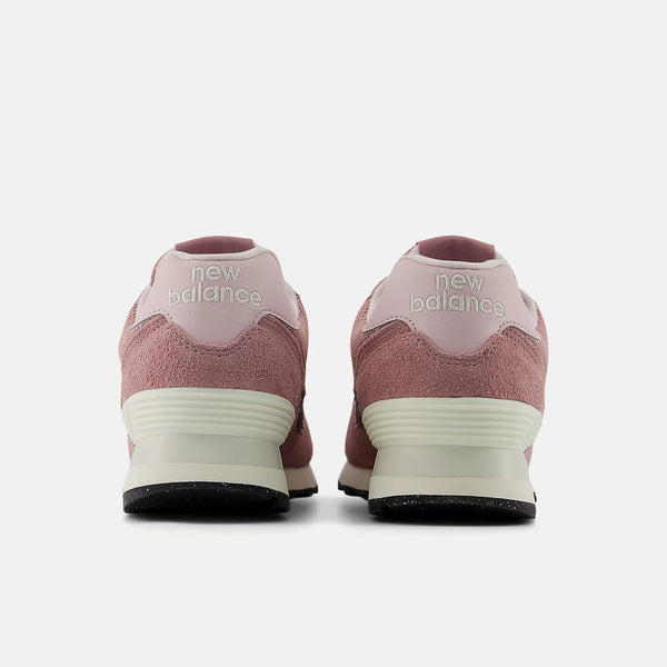 Pink New Balance sneakers shown from the back on a white background