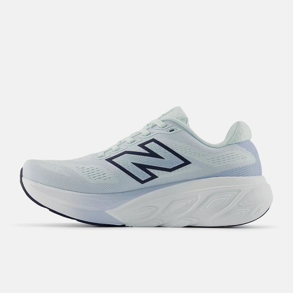 Medial side of a ight blue running shoe with New Balance logo on a white background
