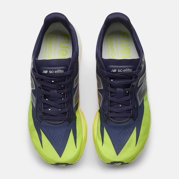 Navy and green running shoes with 'FuelCell' branding on a white background
