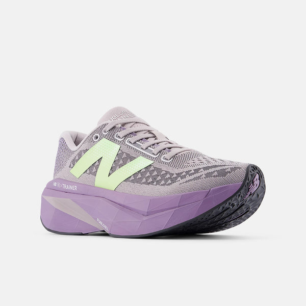 Gray and purple running shoe with neon green accents on a white background