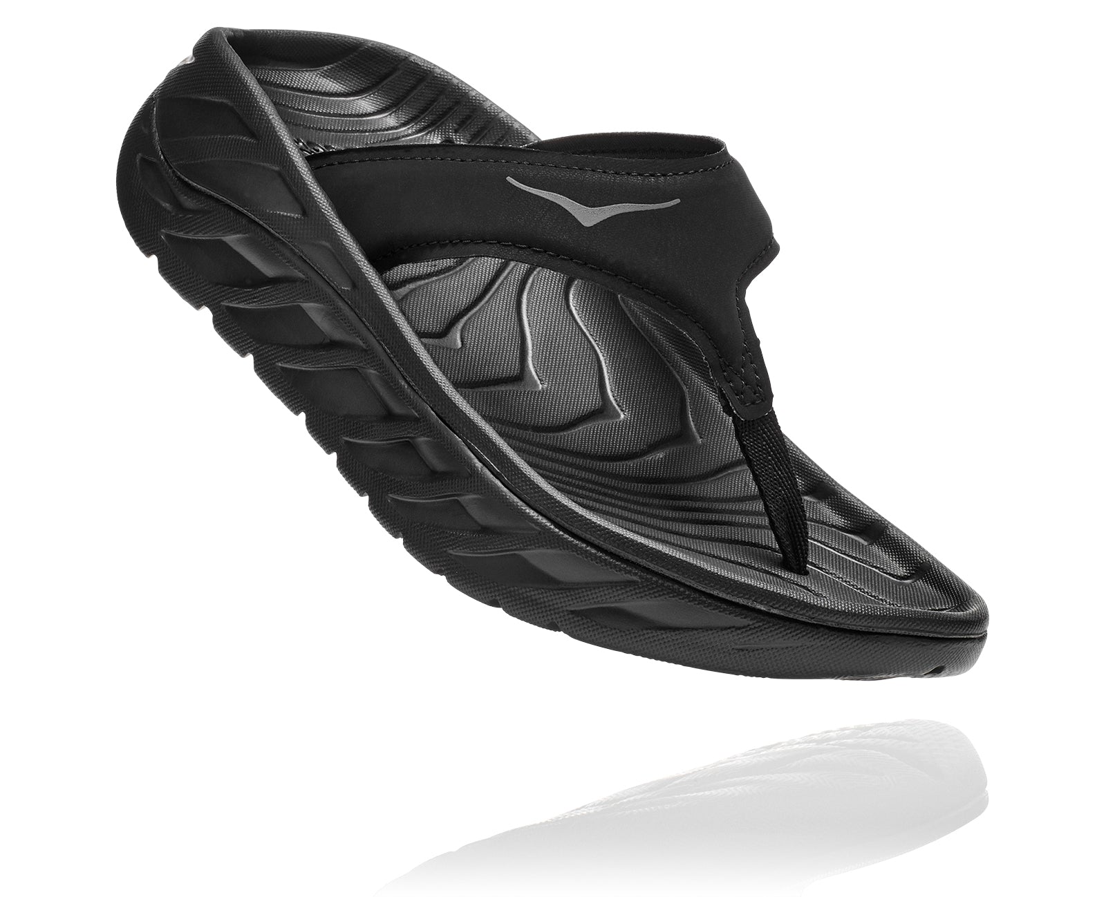 Angled lateral view of the Women's HOKA Ora Recovery Flip in the color Black/Dark Gull Gray