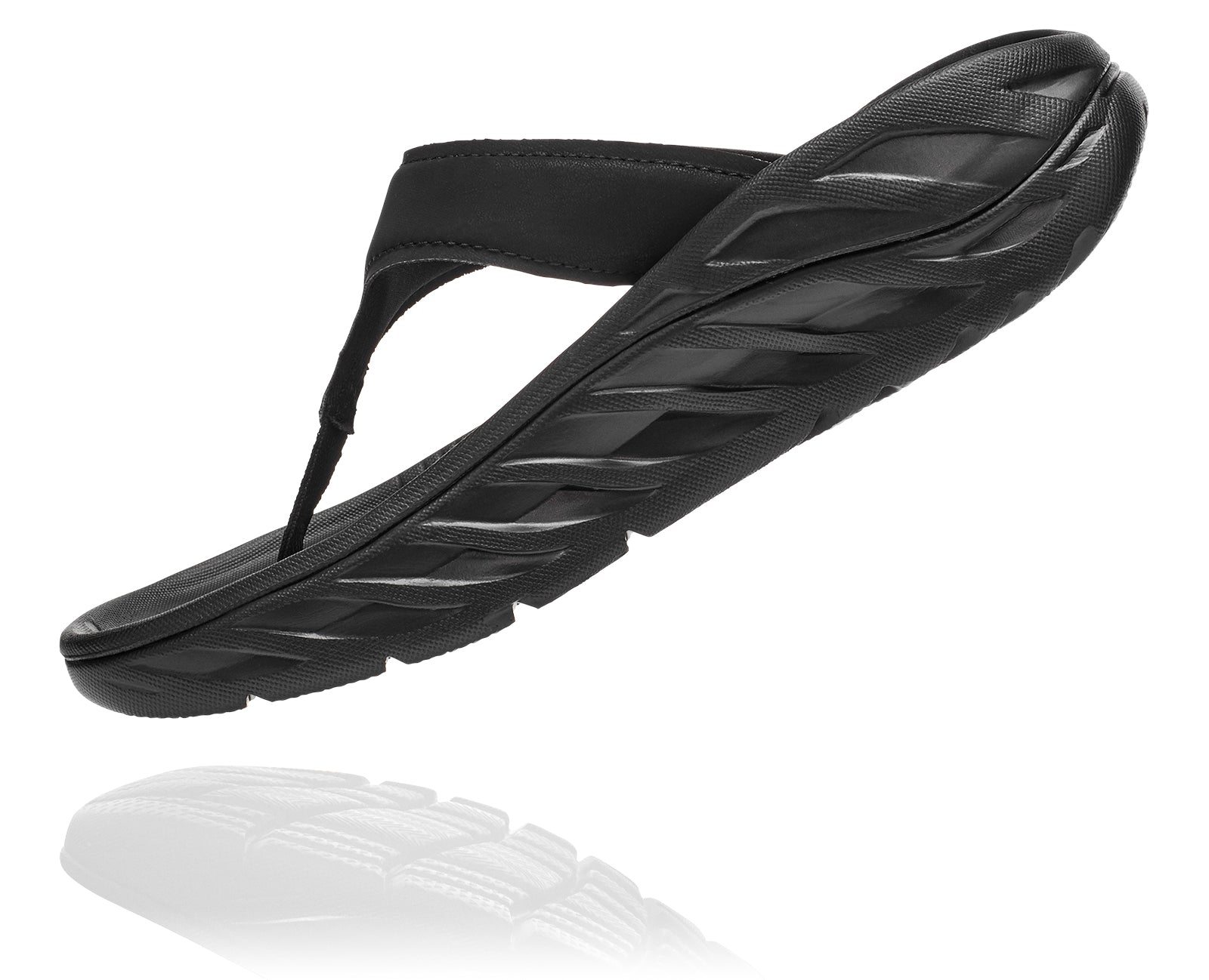 Angled medial view of the Women's HOKA Ora Recovery Flip in the color Black/Dark Gull Gray