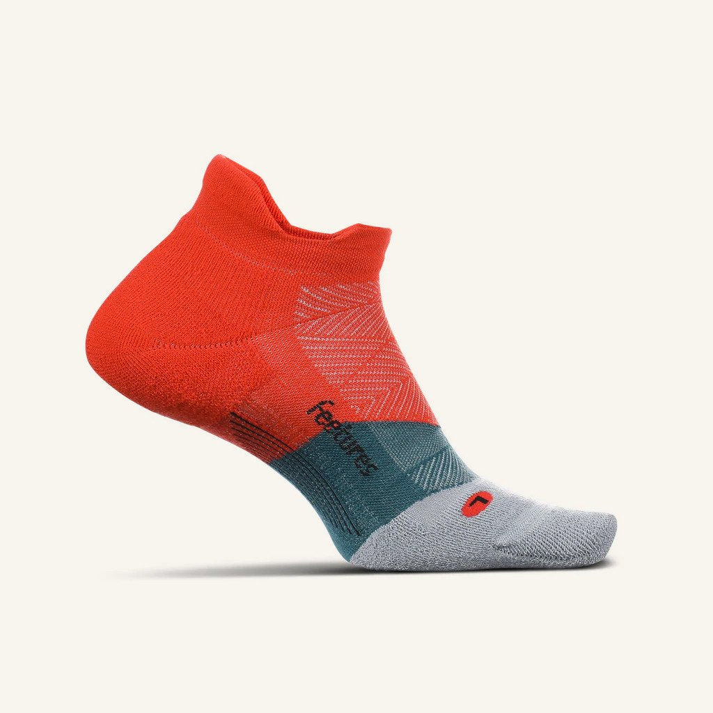 Medial view of the Feetures Elite Max cushion no show tab sock in the color racing red
