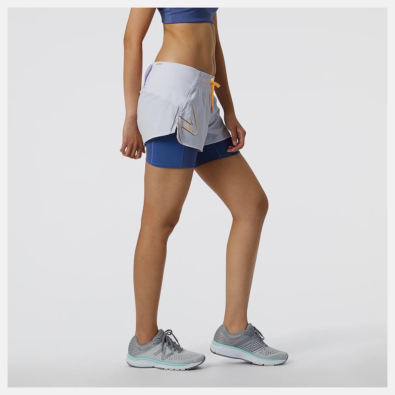 Featuring a lightweight woven shell and fitted inner short with NB DRYx wicking technology, our Printed Impact Run 2in1 Short helps you feel cool and dry on your run. These women's running shorts have a storage tunnel to thread extra layers through for a hands-free workout. Plus, a drop-in pocket on the inner fitted short offers quick access to nutrition and valuables. Finished with a print and reflective details for style