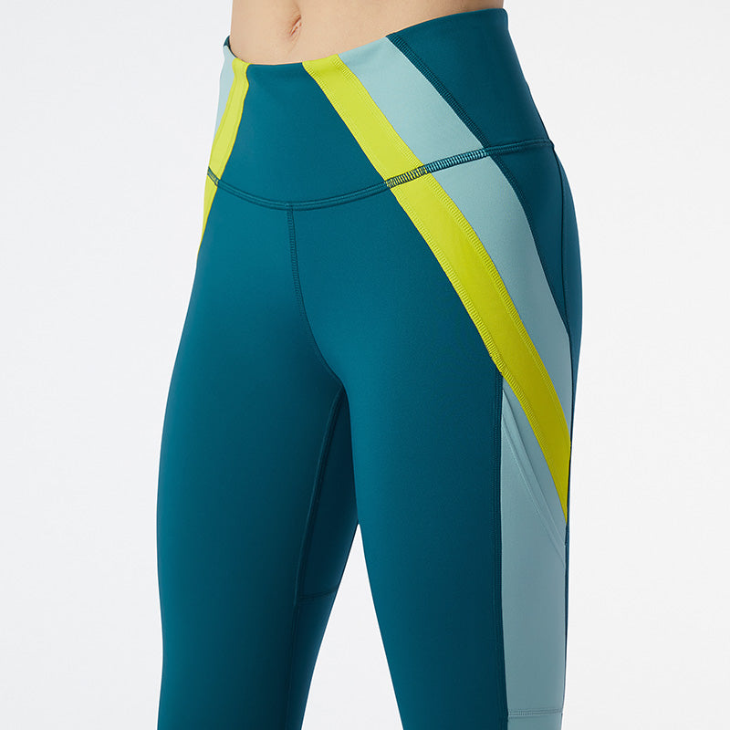 Detailed Front/Side view of the Women's Transform 7/8 NBSleek Tight in the color Mountain Teal