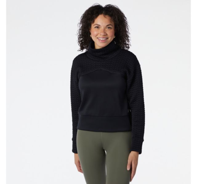 Front view of a model wearing the Women's Heat Loft Pullover by New Balance in Black
