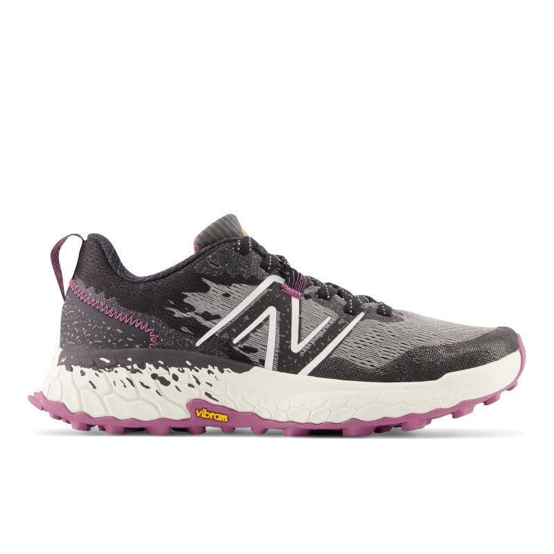 Lateral view of the Women's Trail Hierro V7 by New Balance in the color Castlerock with raisin