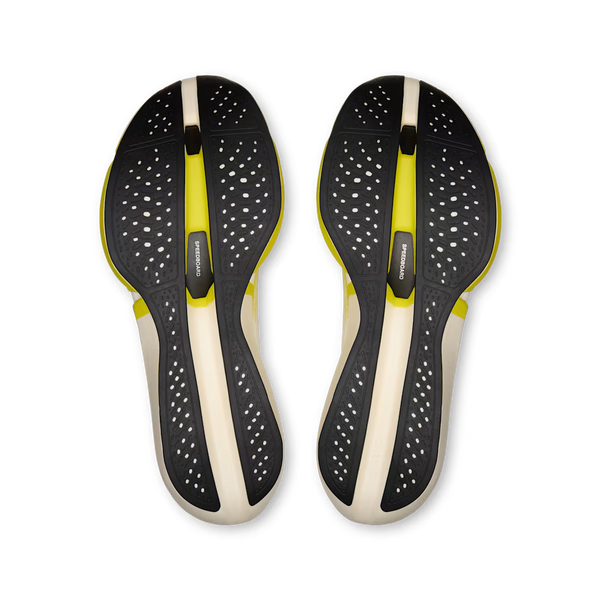 A pair of athletic shoe insoles shown from a top-down view, featuring a black perforated design with a bright yellow-green accent stripe and a beige center column on a white background.
