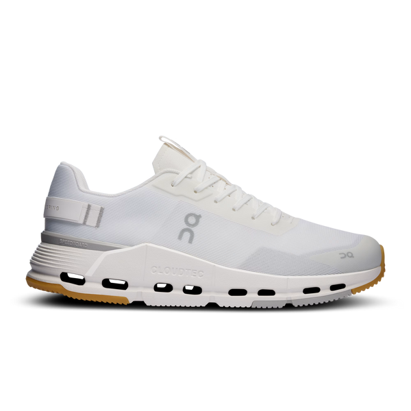 White athletic shoe with visible brand logo on a white background