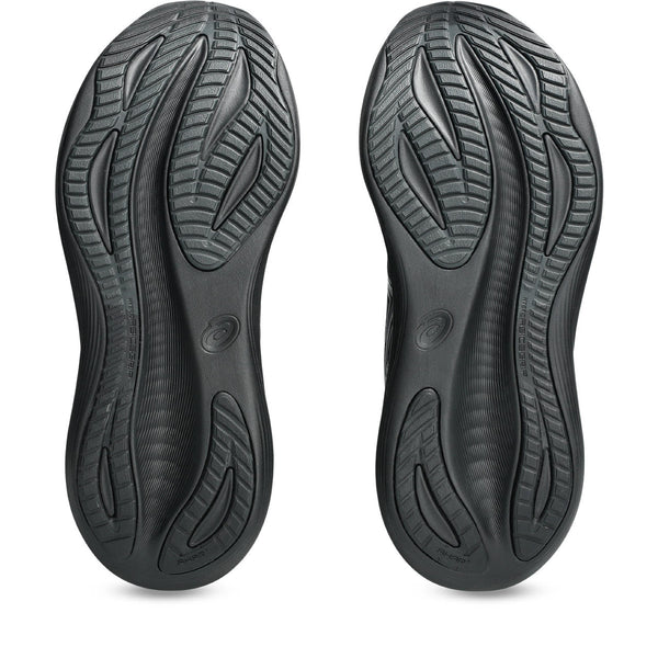 Black shoe soles with tread pattern on a white background.
