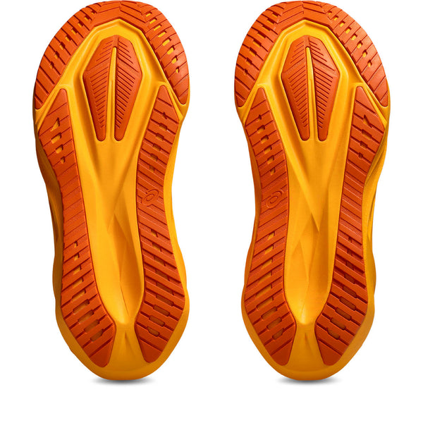 Close-up of orange and yellow shoe soles on a white background
