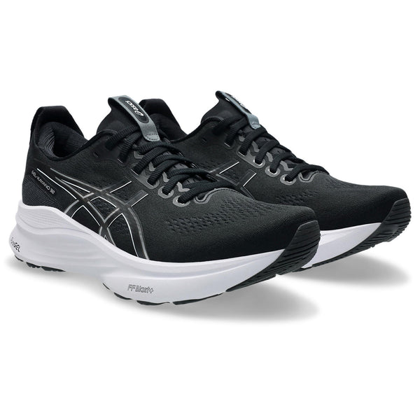 Black running shoes with white soles on a white background