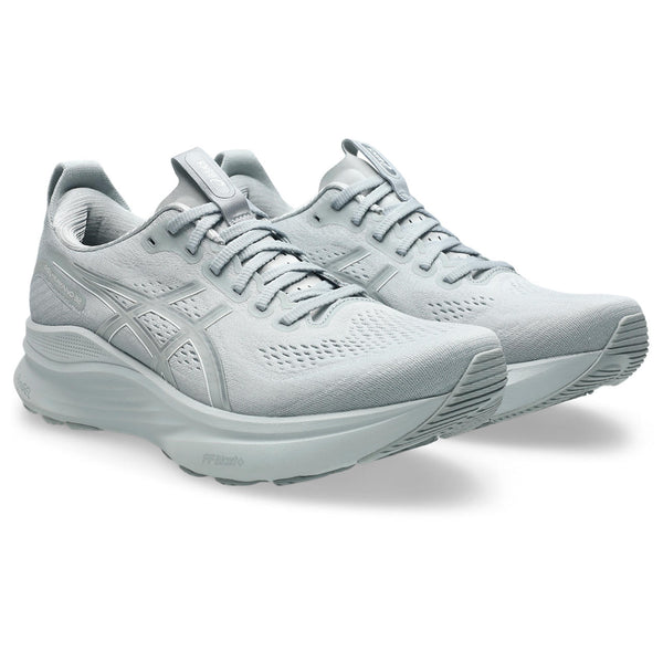 Pair of light gray running shoes with light gray laces.