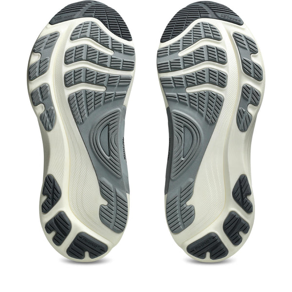Close-up of a pair of shoes with textured soles on a white background.