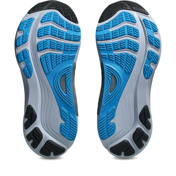 Close-up of a pair of running shoes with blue and gray sole design on a white background