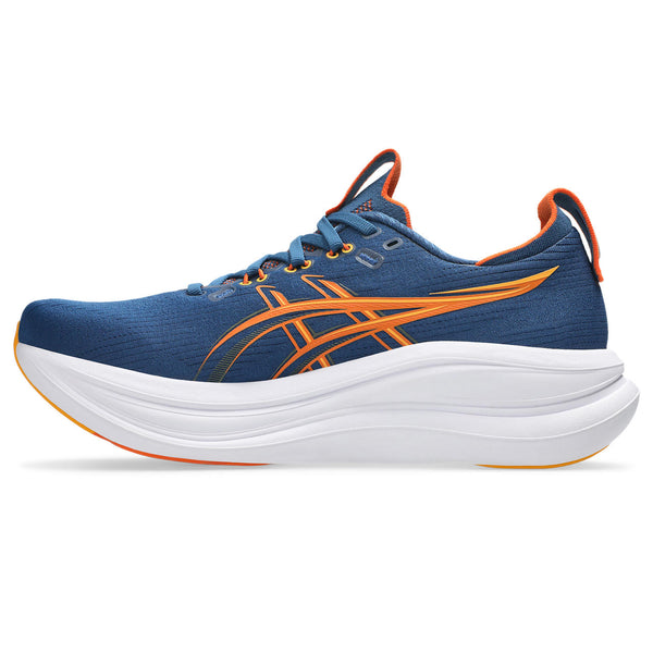 Blue and orange running shoe with white sole on a white background