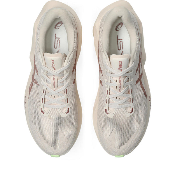 A paid of rose colored ASICS men's running shoes.