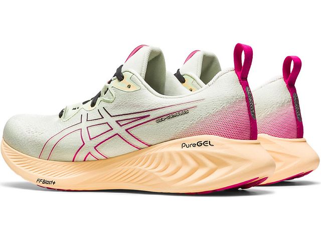 Back angled view of the Women's Cumulus 25 by ASICS in the color Whisper Green/Pink Rave