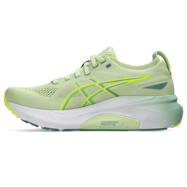 The medial side of a light green ASICS running shoe with white sole on a white background.