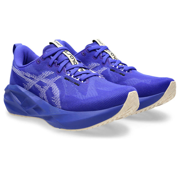 Blue running shoes with a white sole on a white background