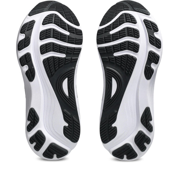 Close-up of black and white athletic shoe soles of the ASICS Gel-Kayano 32.