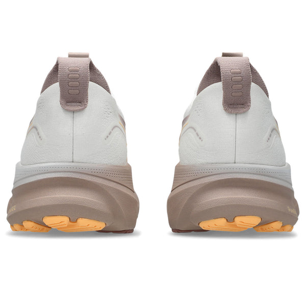 White and brown shoes with orange sole on a white background